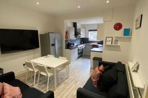 A modern kitchen with sleek appliances and a sp...