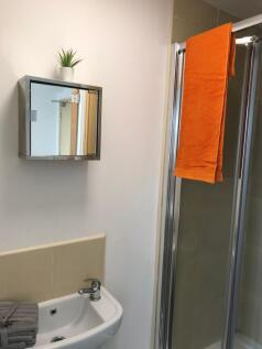 Modern bathroom featuring a sleek shower, styli...