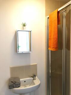 This well-maintained bathroom features a clean ...