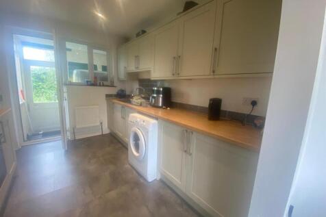 This modern kitchen features ample counter spac...