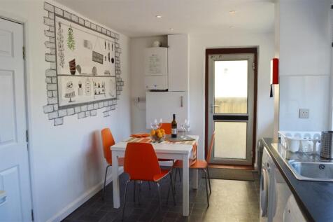 Bright and modern kitchen featuring a dining ar...