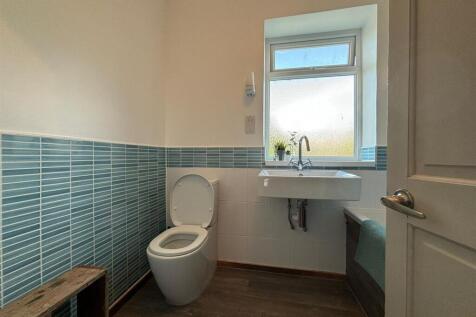 A bright and modern bathroom featuring a stylis...