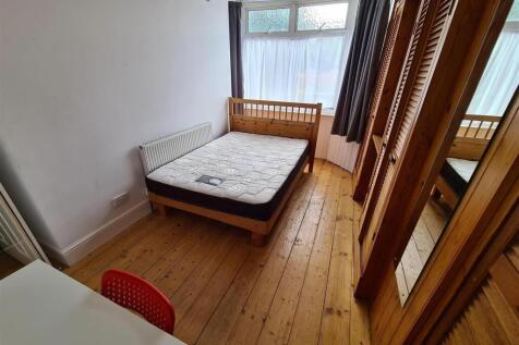 Bright and inviting double bedroom featuring a ...