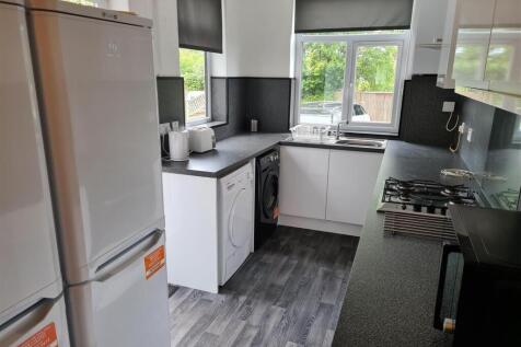 Bright and modern kitchen equipped with essenti...
