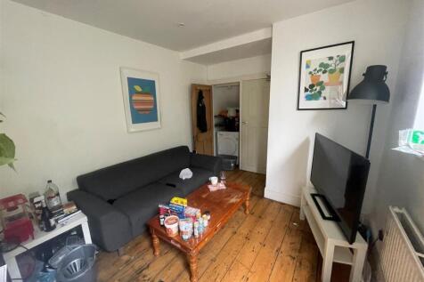 Bright and inviting living room featuring a coz...