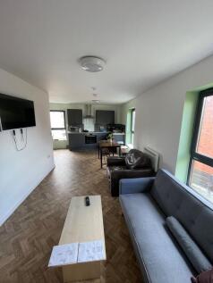 Spacious and inviting living room featuring mod...