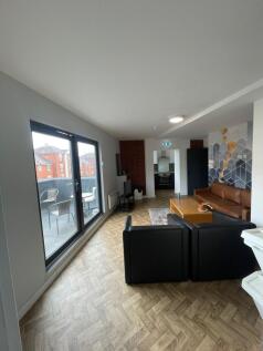 Spacious and contemporary living room featuring...