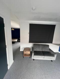 A stylish living room featuring a comfortable g...