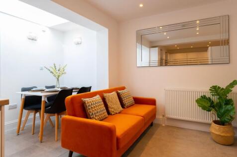 Bright and inviting living room featuring a war...