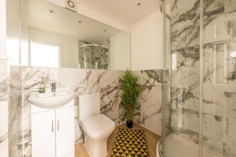 Stylishly designed bathroom featuring elegant m...