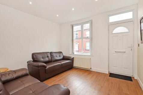 A bright and inviting living room featuring com...
