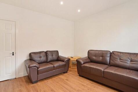 A cozy living room featuring comfortable leathe...