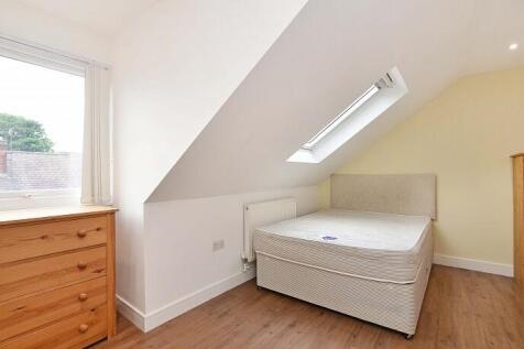 This charming double bedroom features a cozy la...
