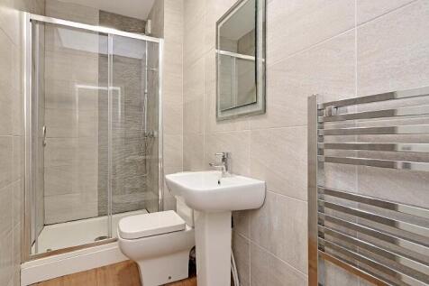This modern bathroom features a sleek design wi...