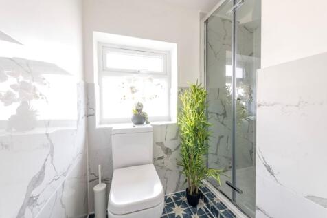 This contemporary bathroom features a stylish s...