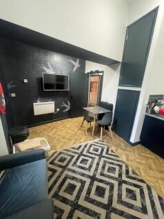 This inviting living room features a stylish de...