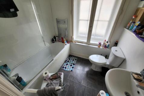 Bright and functional bathroom featuring a bath...