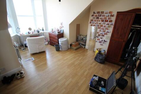 Spacious double bedroom featuring ample natural...
