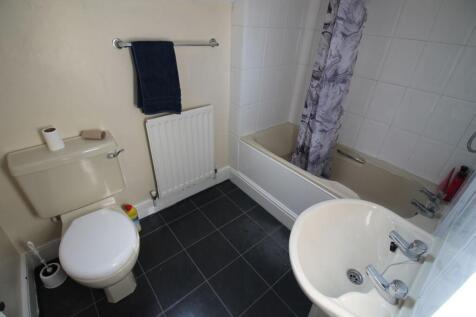 This well-maintained bathroom features a bathtu...