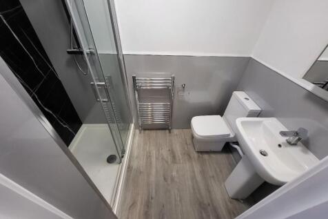 A modern bathroom featuring a sleek design with...