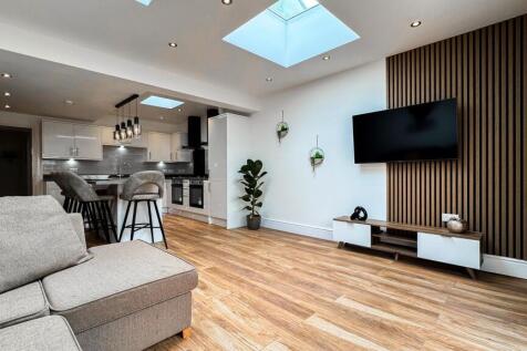 A beautifully designed living room featuring mo...