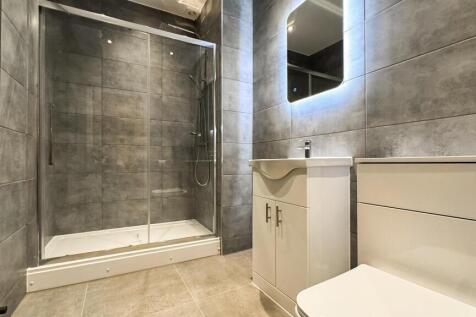 A modern bathroom featuring sleek fixtures and ...