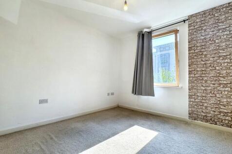 This charming double bedroom features ample nat...
