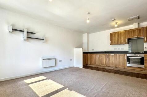 This cozy living room features a warm and invit...