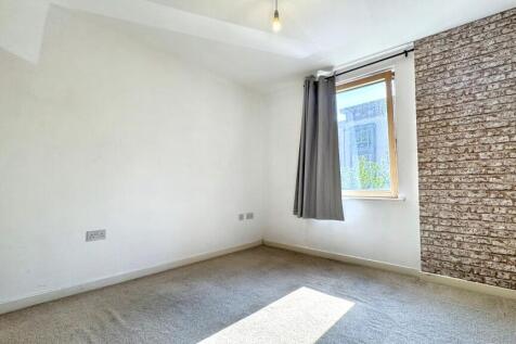A bright and inviting double bedroom featuring ...