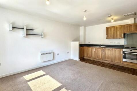Bright and functional kitchen area featuring mo...