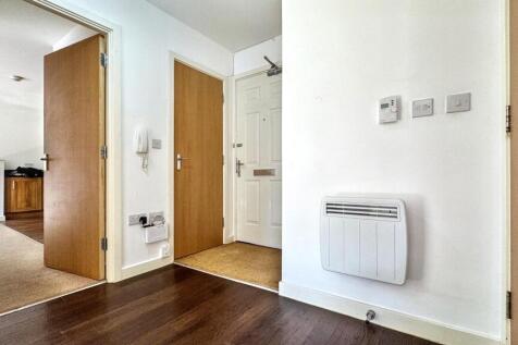 A welcoming hallway featuring modern decor and ...