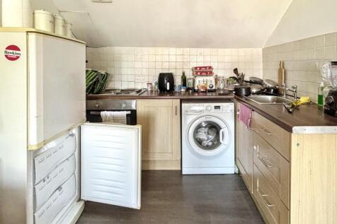 This cozy kitchen features essential appliances...