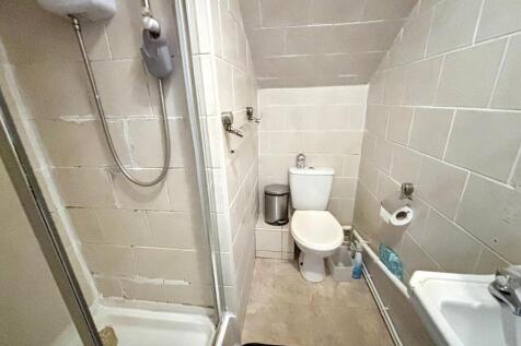 A well-maintained bathroom featuring a modern s...