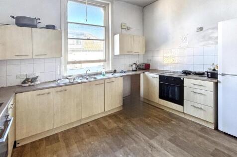 Spacious and well-lit kitchen featuring modern ...