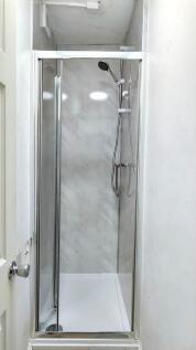 Bright and modern shower space featuring sleek ...