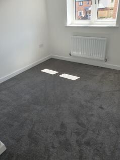 This inviting double bedroom features ample nat...