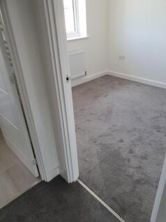 A bright and inviting double bedroom featuring ...