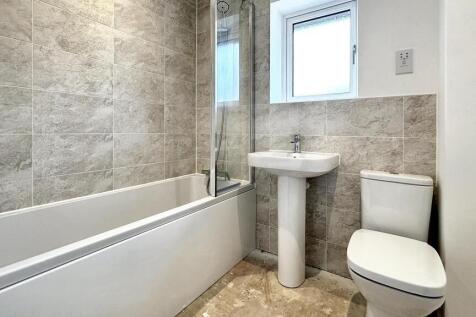 This well-maintained bathroom features modern t...