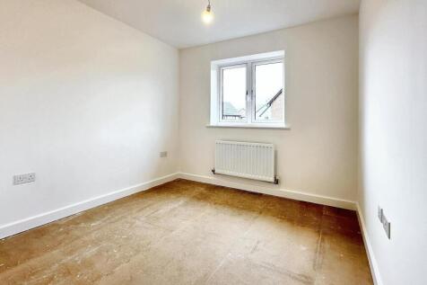This inviting double bedroom features a bright ...