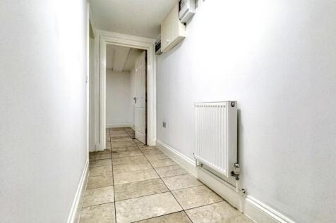 Bright and spacious hallway with modern tiling,...