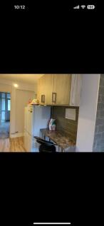 Bright and modern kitchen featuring ample stora...