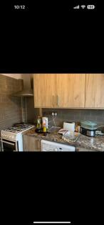 This modern kitchen features stylish cabinetry ...