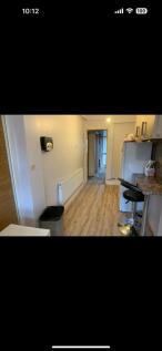 Bright and functional kitchen area featuring mo...