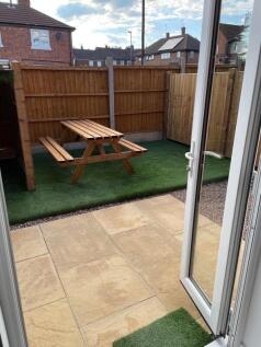 Bright and well-maintained garden area featurin...
