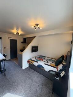 A modern, well-lit double bedroom featuring a c...