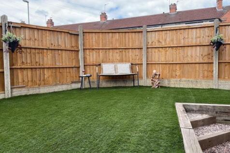 A well-maintained private garden featuring lush...