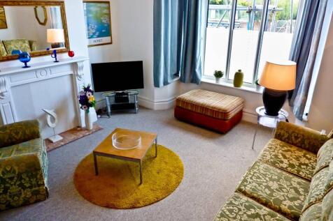 A cozy and inviting living room featuring styli...
