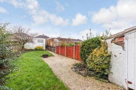 A beautifully maintained garden featuring lush ...