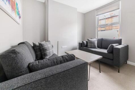 This contemporary living room offers a cozy atm...