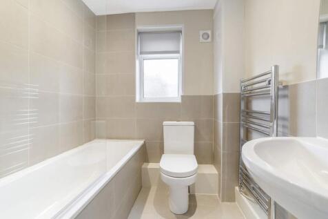 This modern bathroom features a sleek design wi...